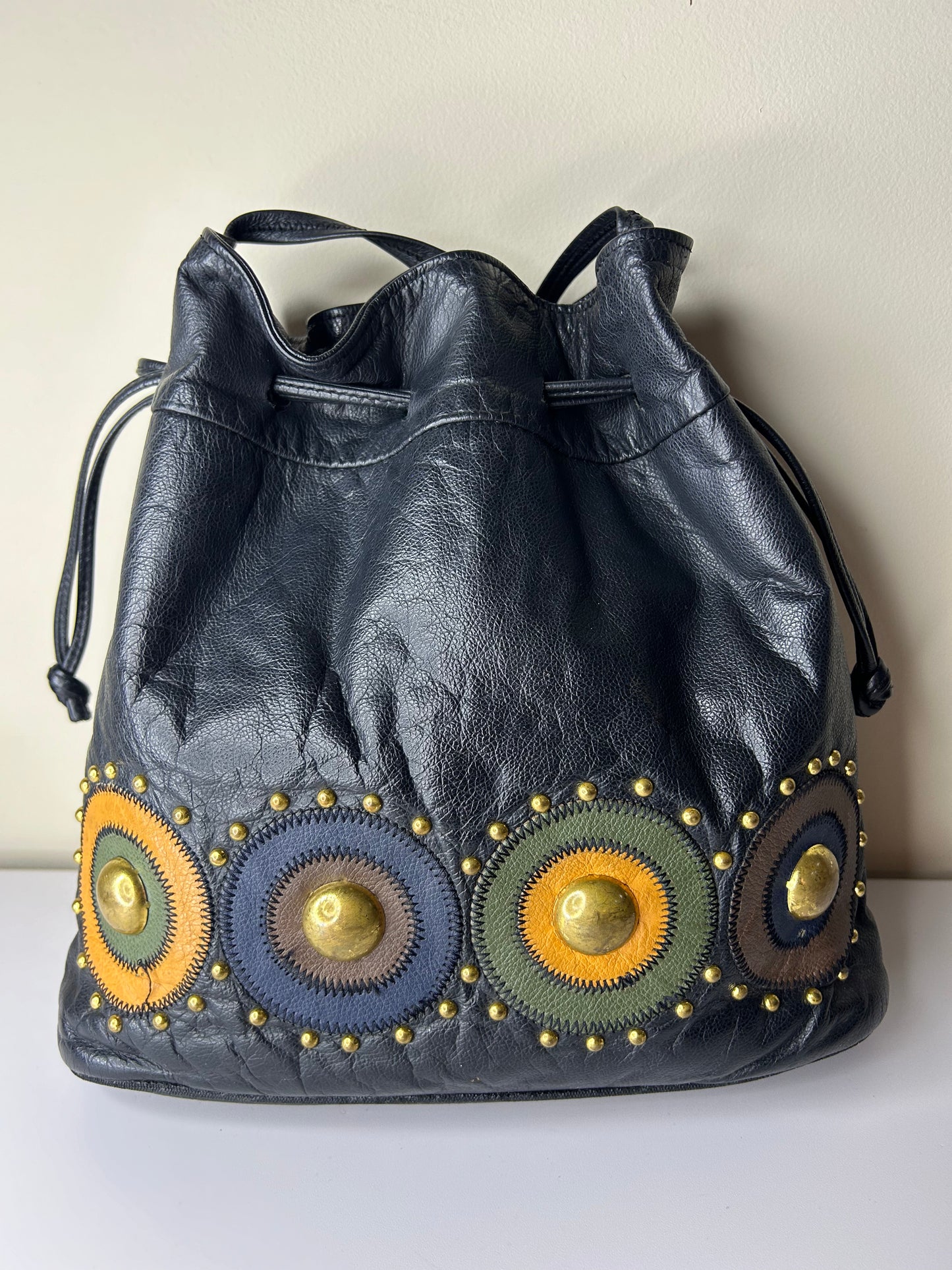 Lido Drawstring Bucket Bag with Gold Studs