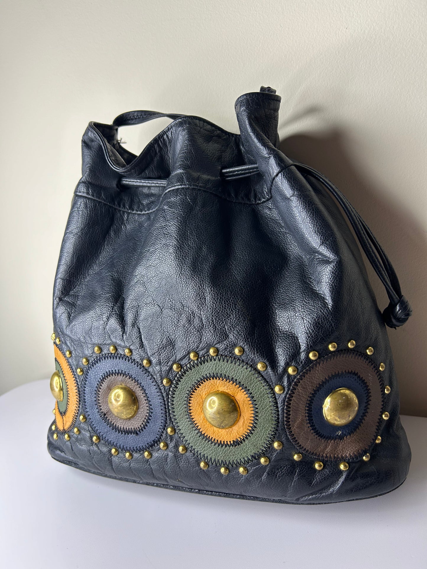 Lido Drawstring Bucket Bag with Gold Studs